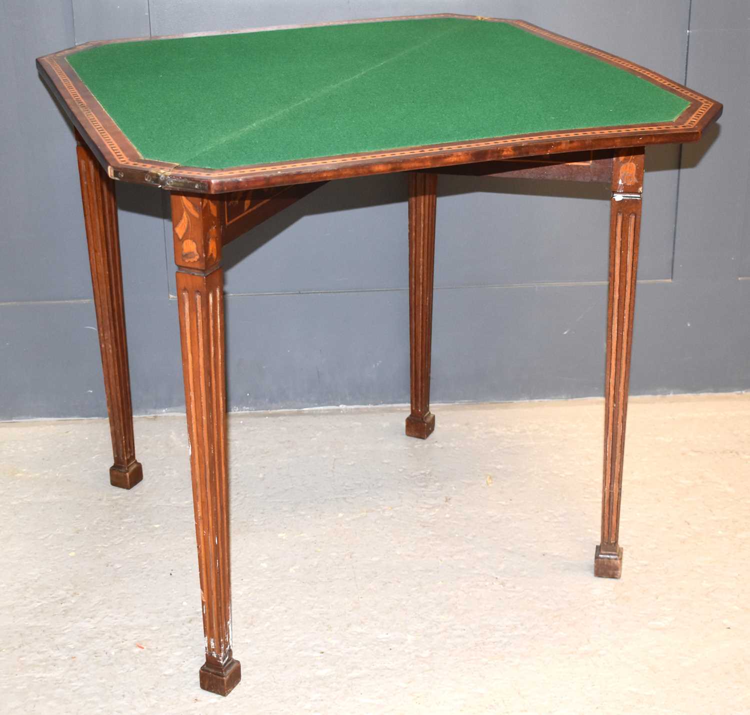 A late 19th or early 20th century card table, the marquetry top depicting bird amongst foliage,