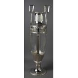 A large Art Nouveau silver plated German Orvit urn form vase, the twin handles above reeded glass