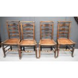 Four 19th century ladder back chairs, with plank seats, shaped back rails, and turned legs and