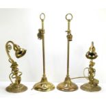 A pair of vintage brass stick adjustable table lamps in the French style, the reeded columns with