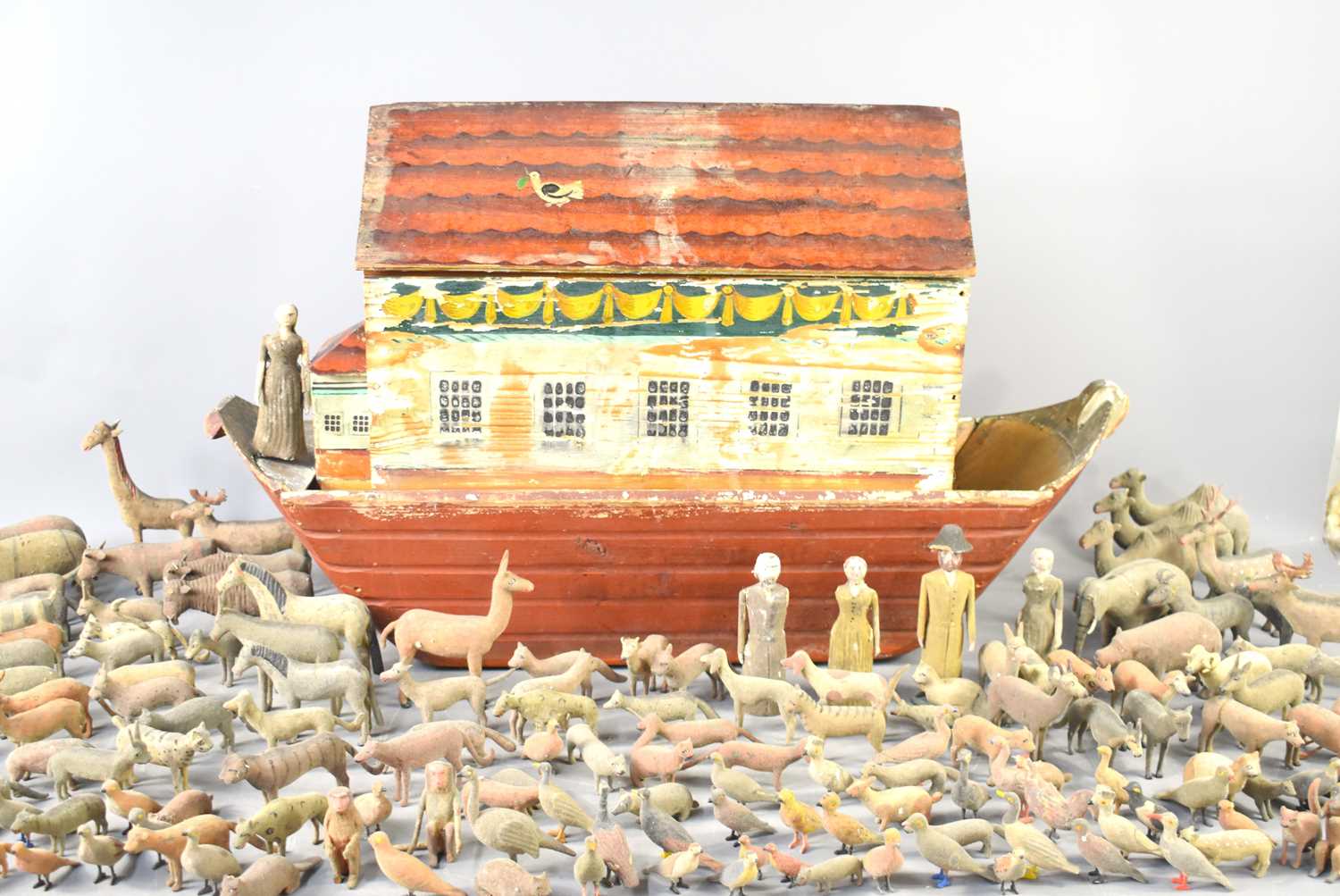 A large Erzgebirge German Noah's ark and animals, mid 19th century, the pine arc painted with
