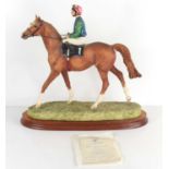 A Border Fine Arts sculpture "On Parade" the horse and jockey raised on a wooden plinth, limited