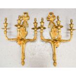 A pair of 19th century French gilt bronze wall sconces, with three branches raising 'candle'
