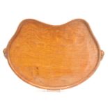 A Robert "Mouseman" Thompson oak kidney shaped tea tray, with a carved mouse to each handle, 48cm