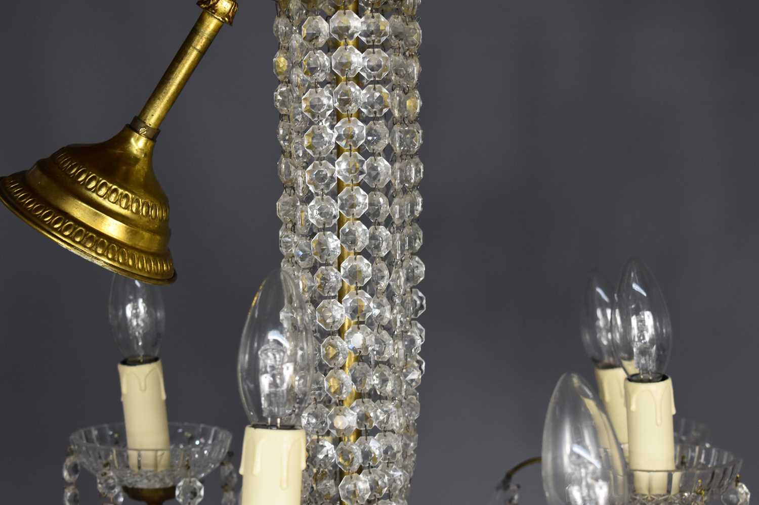 A glass and gilt metal nine branch chandelier, each of the scroll branches with three sprigs holding - Image 3 of 3