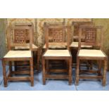 A set of six Robert "Mouseman" Thompson oak lattice back dining chairs with cow hide seats, on two