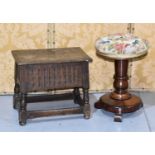 A late 19th/ early 20th century oak stool, with lift lid, linen fold carving to the sides and raised