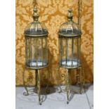 A pair of impressive free standing gilt metal and glass lanterns of twelve sided form with domed top