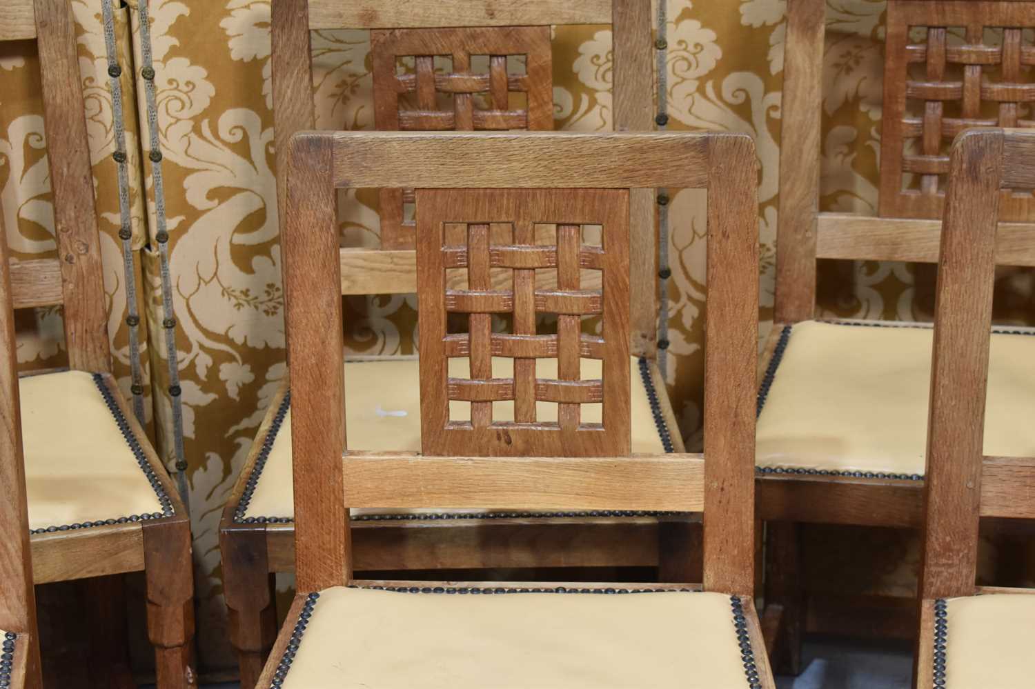 A set of six Robert "Mouseman" Thompson oak lattice back dining chairs with cow hide seats, on two - Image 4 of 4