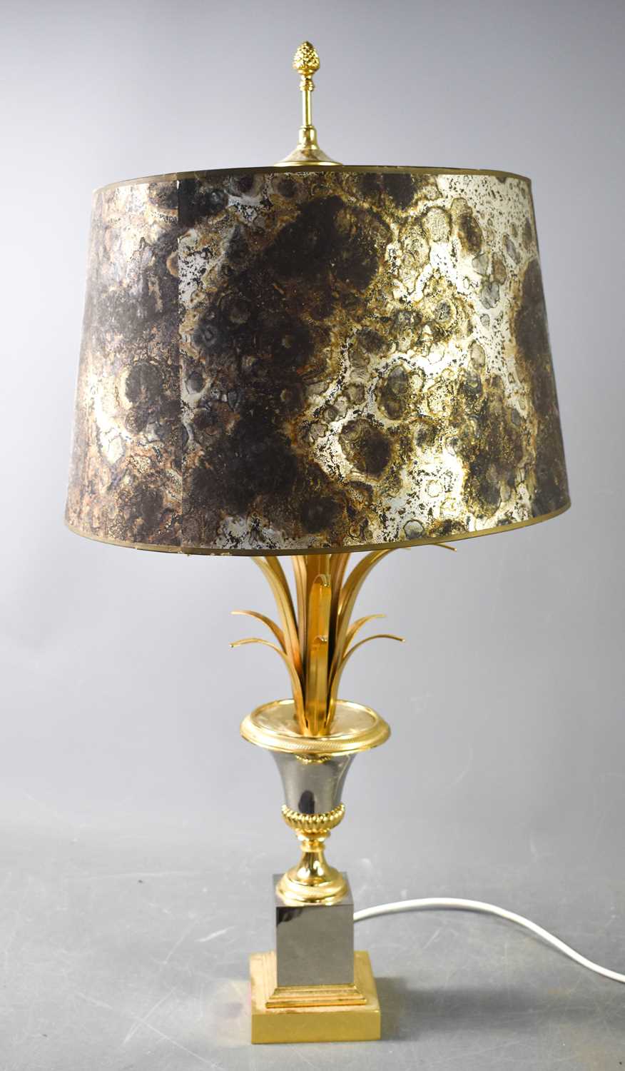 An American style 1980s pineapple lamp in steel and gold coloured metals, and mottled metallic