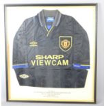 A 1994 Manchester United football shirt, framed and glazed.