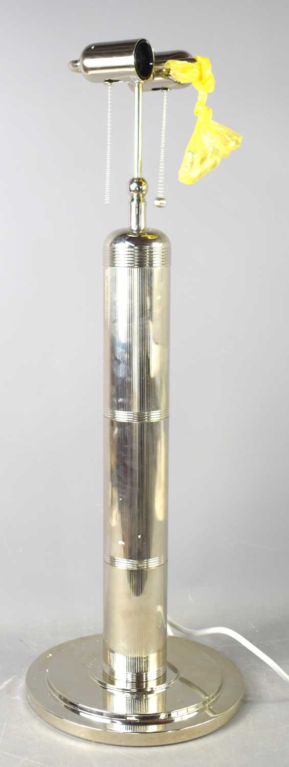 An impressive designer table lamp, in the form of an air cylinder of reeded form with two light