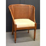 A Willis and Gambier Lille cane work bergere bedroom chair.