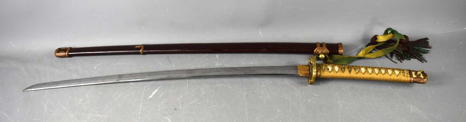 A WWII period Japanese officers Shin Gunto sword with rayskin tsuka wrapped with cord binding,