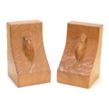 A pair of Robert "Mouseman" Thompson oak bookends, each with a single carved mouse to each end, 15cm