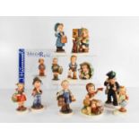 A group of ten German Goebel M J Hummel figurines, some signed to the bases, and one limited edition