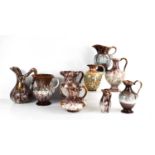 A selection of West German pottery jugs, of the mid-century period, in various glazes and designs.