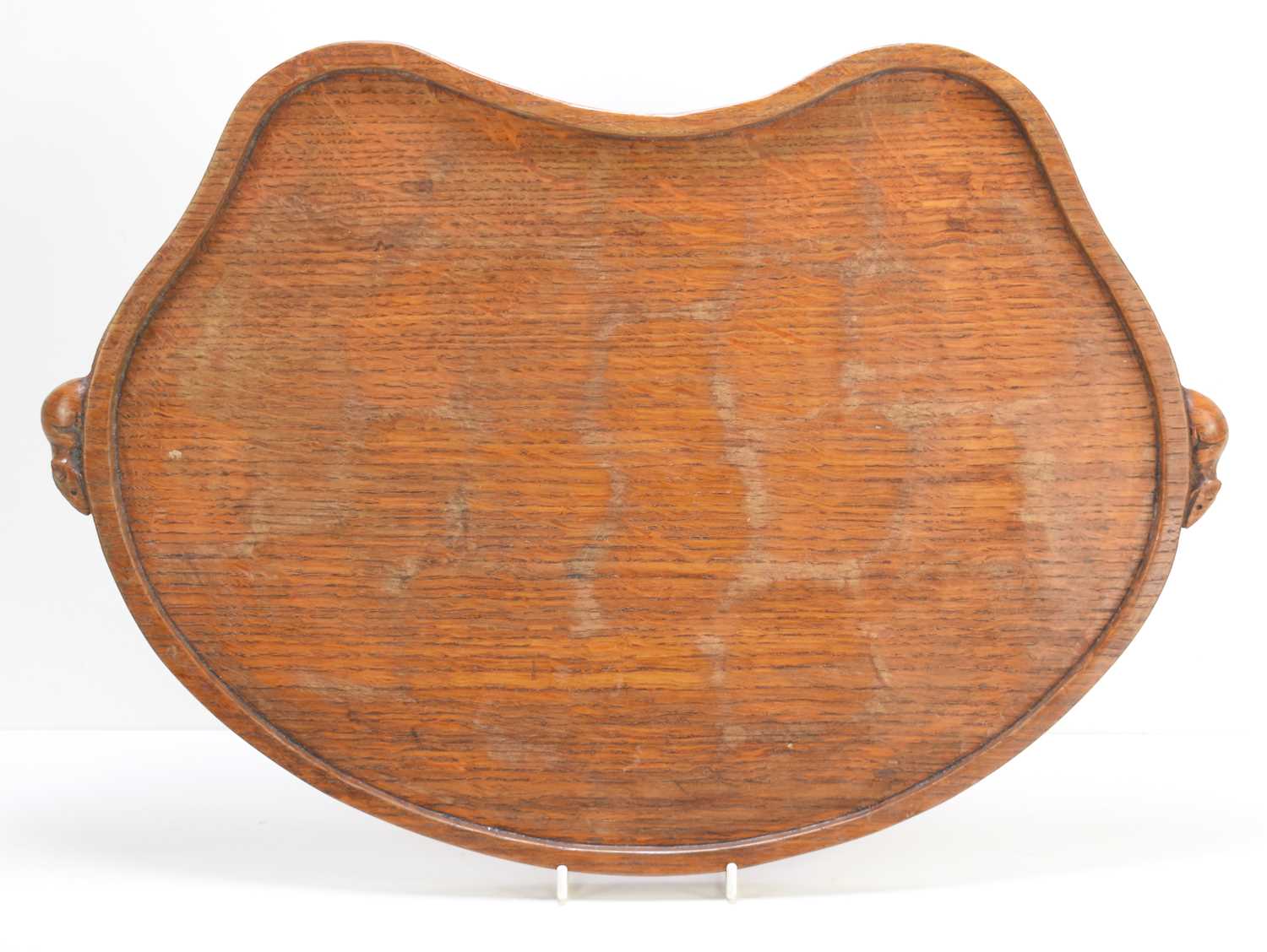 A Robert "Mouseman" Thompson oak kidney shaped tea tray, with a carved mouse to each handle, 48cm