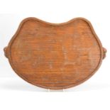 A Robert "Mouseman" Thompson oak kidney shaped tea tray, with a carved mouse to each handle, 48cm
