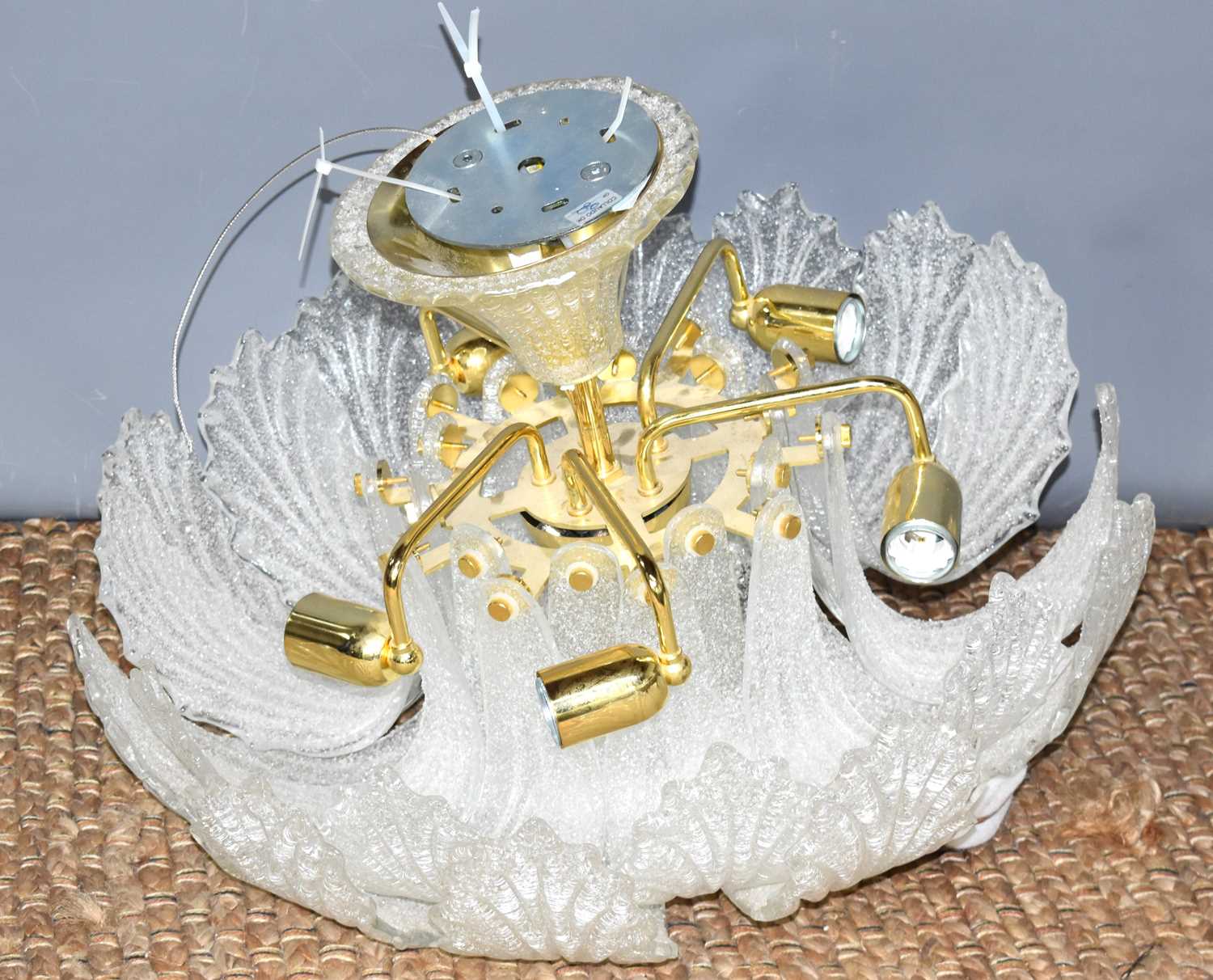An ornate frosted glass ceiling light, likely Murano of tiered acanthus leaf form, 61cm diameter.