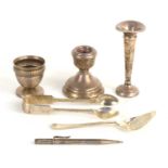 A group of silver to include a Sampson Mordan silver propelling pencil, sugar tongs, candlestick and