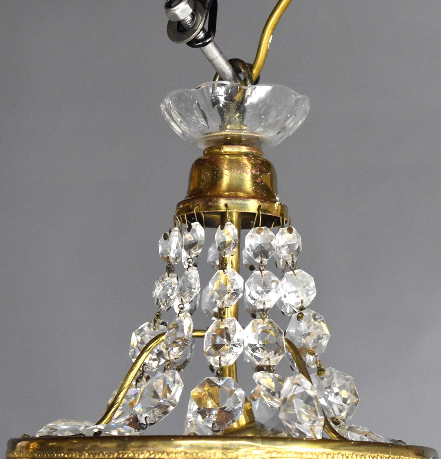 A group of three cut glass and gilt metal chandeliers, comprising one of bag form and two Empire - Image 2 of 4