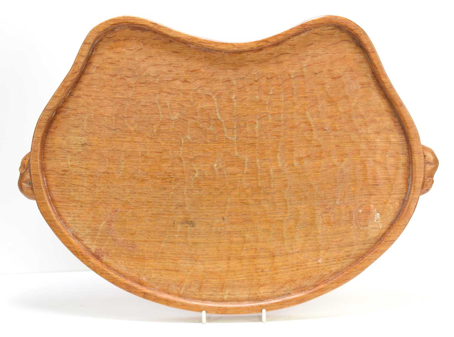 A Robert "Mouseman" Thompson oak kidney shaped tea tray, with a carved mouse to each handle, 48cm