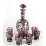 A set of six 19th century amethyst liqueur glasses and decanter, each derated with silver coloured