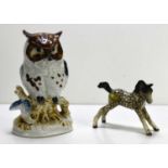 A small Beswick dapple grey foal, 7.5cm high together with a ceramic owl ornament.The foal is