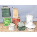A group of vintage BP and Esso fuel cans together with two galvanised chicken feeders.
