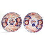 A pair of 19th century Imari plates, signed to the base, 24.5cm diameter.