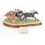 A Border Fine Arts horse racing sculpture "On the Rails" by Anne Wall, raised on a wooden plinth,