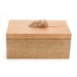 A Robert "Mouseman" Thompson oak lidded box with carved mouse to the lid.