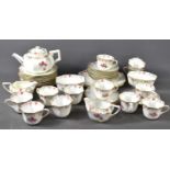 A Royal Doulton tea set, hand painted with flowers, to include a teapot, milk jug, sugar bowl and