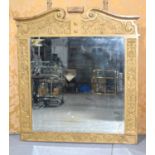 A large and impressive over mantle mirror in the Fontainebleau style, with ribbons and bows to the