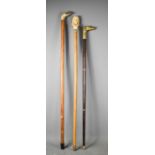 Three vintage walking canes, one having a resin bust of Bach for the handle, one in the form of a