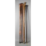 A group of five vintage walking canes of various style and form, to include one ebonised example,