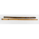 Two antique walking canes with silver plated caps, one in bamboo, the other in carved hardwood