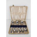 A set of six Georgian silver tea spoons, engraved with decoration, London 1803, in the original