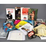 A collection of vintage and retro James Bond ephemera, to include a James Bond luncheon menu card