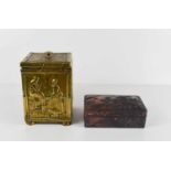 A 19th century brass clad tea canister, likely dutch, each panel embossed with decoration, one of