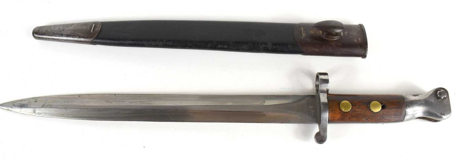 A British 1888 pattern bayonet and scabbard, MKI 2nd type, the ricasso stamped with broad arrow