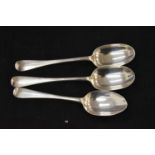A pair of Georgian silver 'rats tail' serving spoons engraved with the letter S, London 1894 and