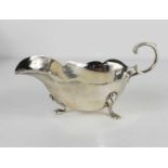 A silver sauce boat, with shaped edge, and three lobed feet, Birmingham 1909, 3.16toz.