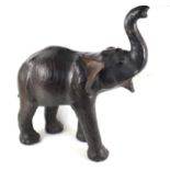An early twentieth century Liberty of London leather elephant, inset with glass eyes, plastic/