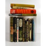 A quantity of vintage hardback and paperback books related to Ian Fleming and James Bond, to include