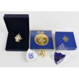 A group of Blue Peter badges to include a gold plated example together with a 22ct gold plated