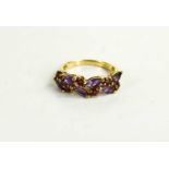 A 9ct gold, amethyst and ruby set dress ring, size Q, 3.15g.