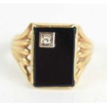 A gentleman's 9ct gold, jet and diamond ring, the rectangular table of jet set with diamond to one