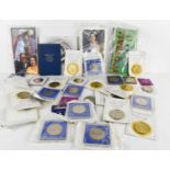 A collection of commemorative crowns and other coins to include Queen Mother five pounds,